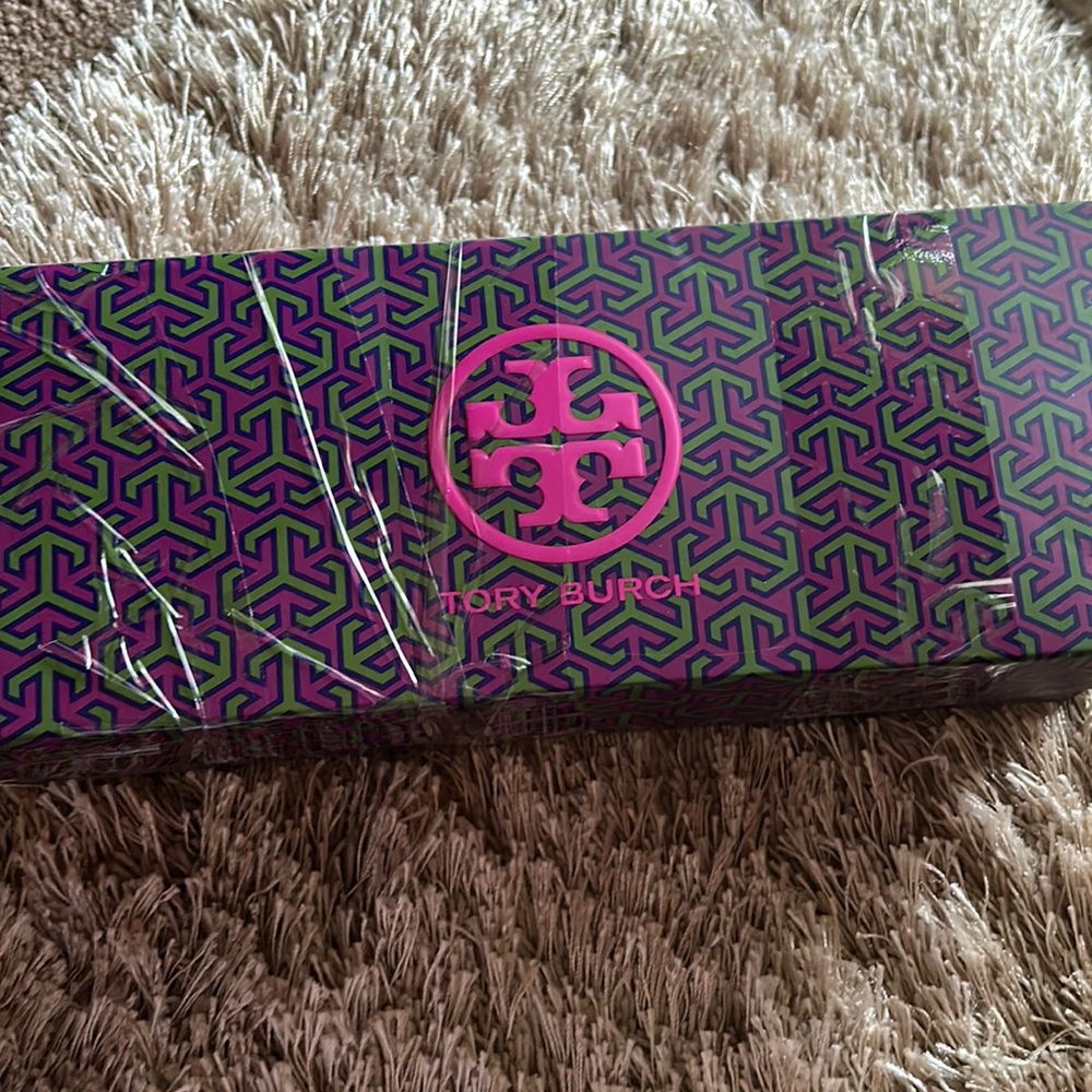 Brand new Tory Burch women’s ballet flats next to new